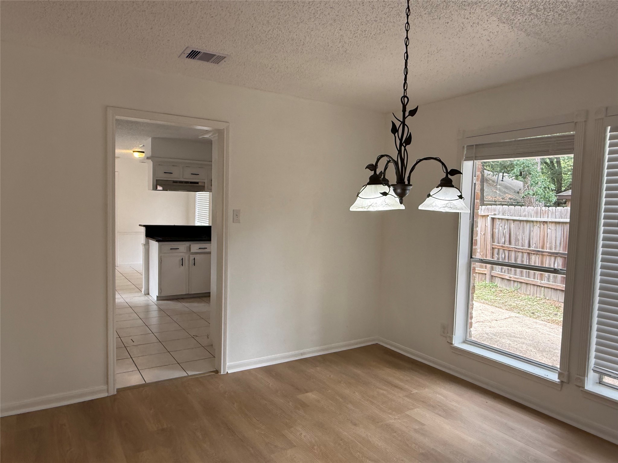 1847 Spruce Knob Drive Houston, TX 77339 - Photo 7 of 26 a view of a room with wooden floor chandeliers and kitchen view