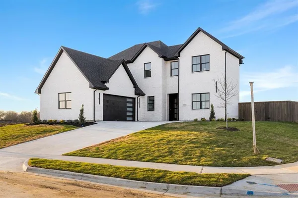 a view of a big house with yard