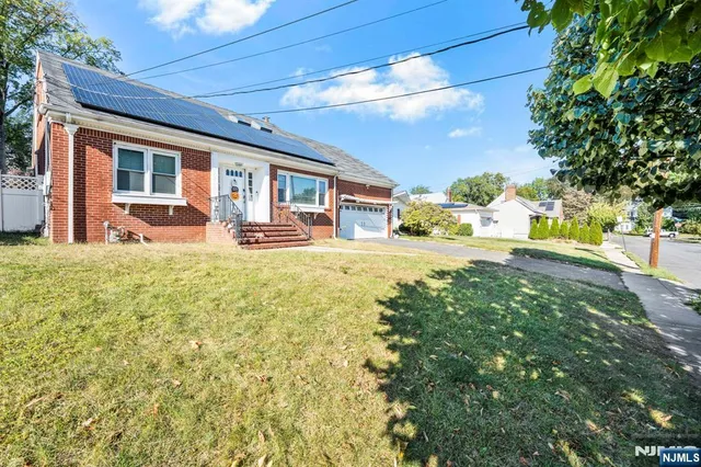 a house view with swimming pool in front of it