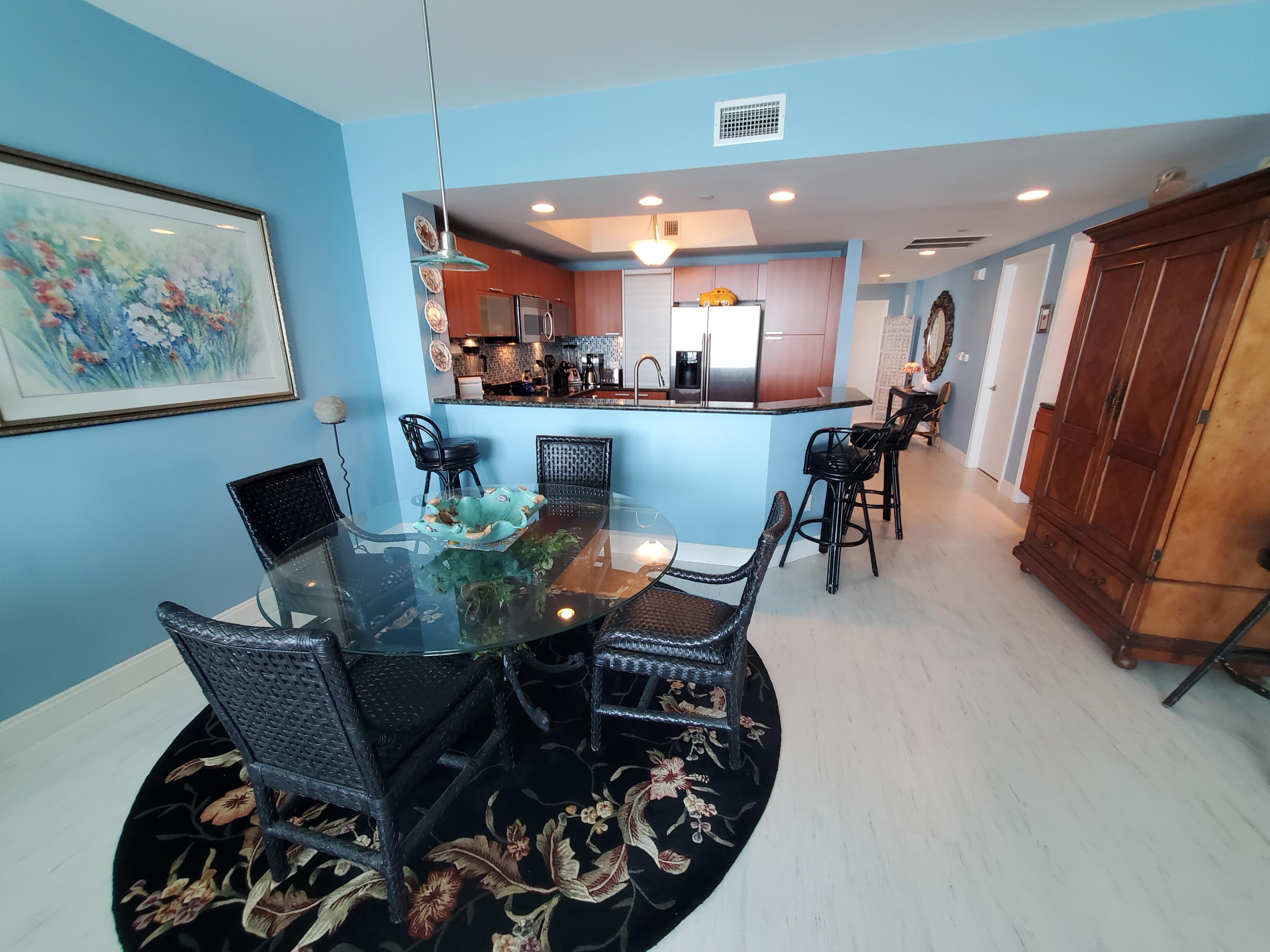 2640 Lake Shore Drive, Unit 2016 Riviera Beach, FL 33404 - Photo 13 of 50 DINING AREA TO KITCHEN