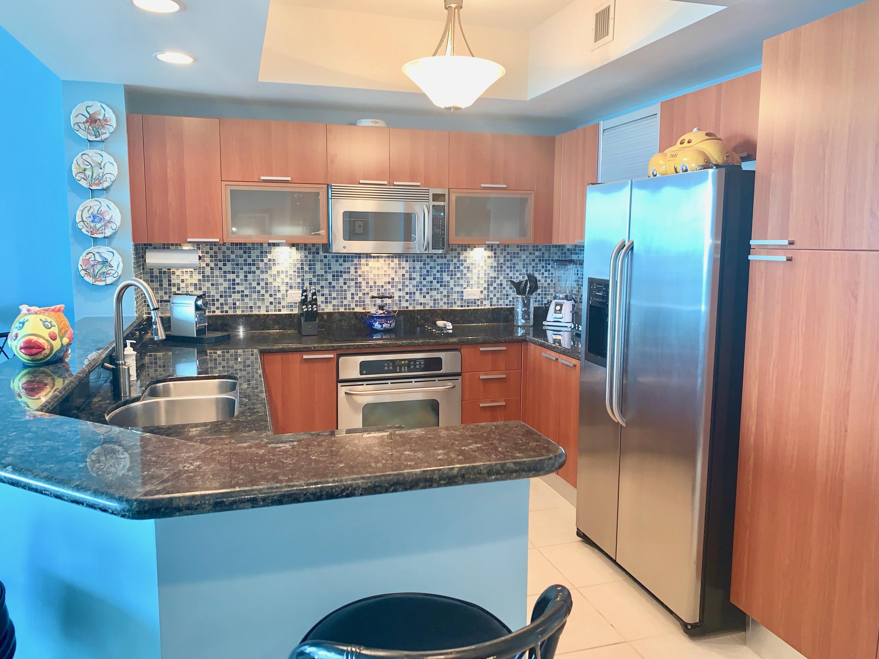 2640 Lake Shore Drive, Unit 2016 Riviera Beach, FL 33404 - Photo 14 of 50 CHERRY WOOD CABINETRY