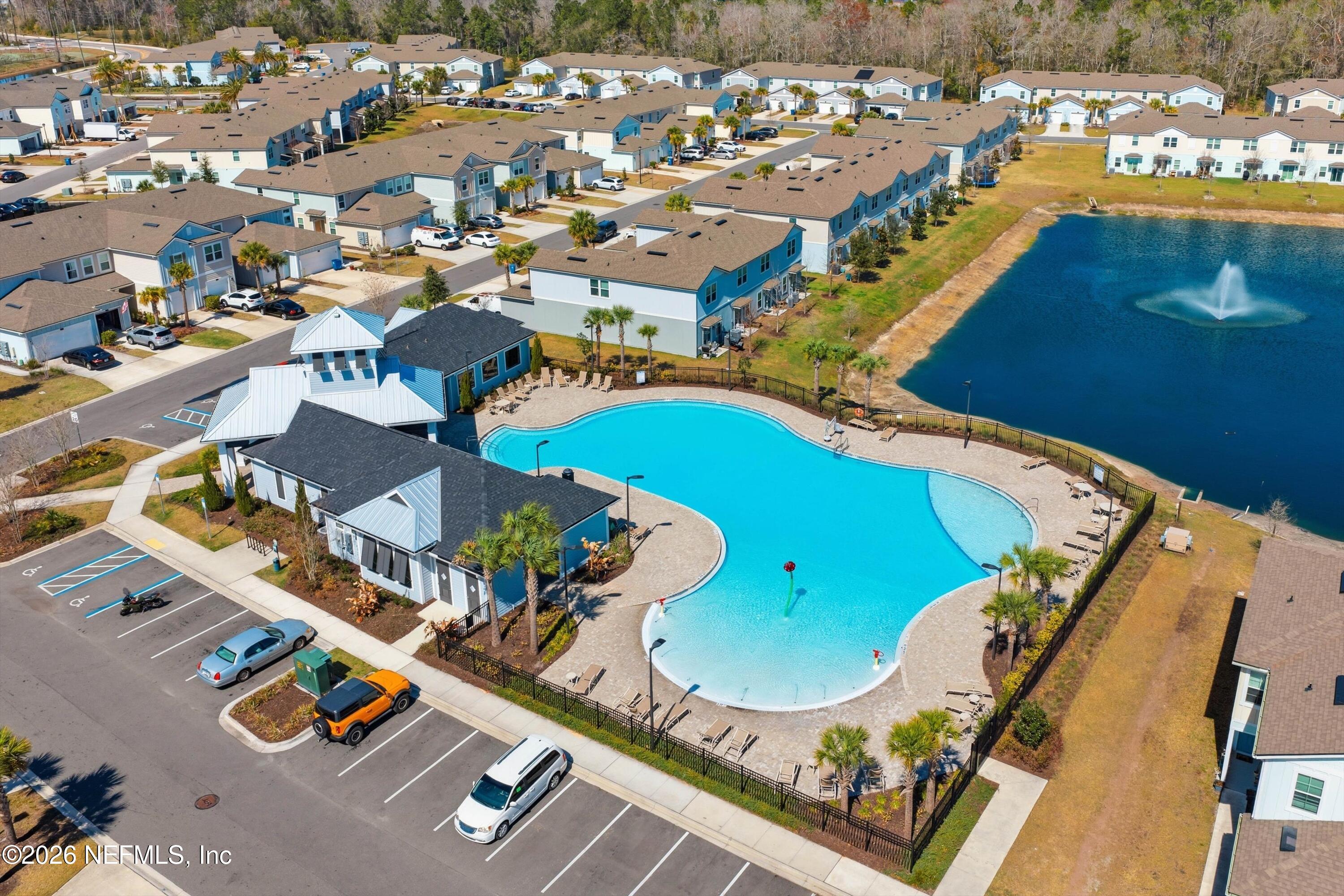 103 Seaport Breeze Road St. Augustine, FL 32095 - Photo 28 of 44 an aerial view of a swimming pool with outdoor space and seating area