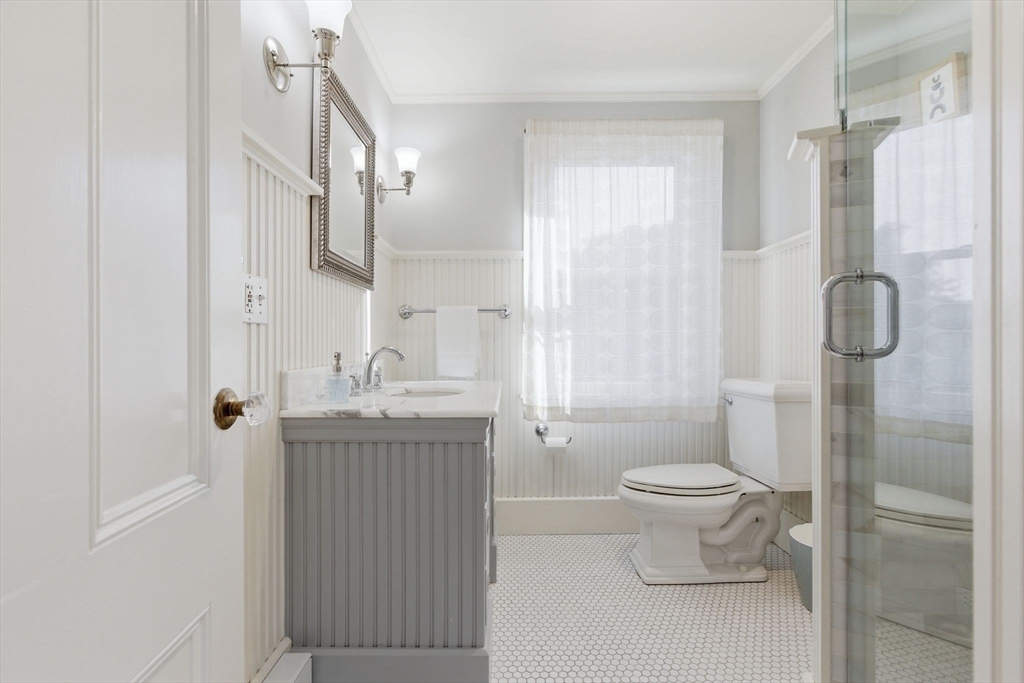 38 Bartlett Street Boston, MA 02129 - Photo 28 of 37 a bathroom with a granite countertop sink toilet and shower
