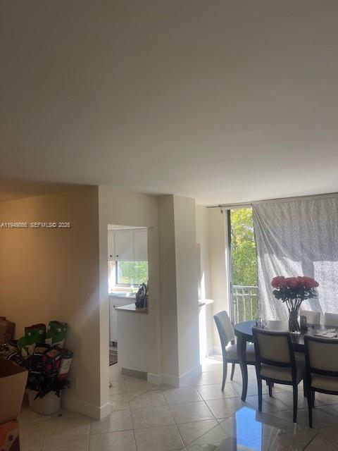 16919 North Bay Road, Unit 414 Sunny Isles Beach, FL 33160 - Photo 3 of 7 a view of a livingroom with furniture and window