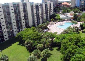16919 North Bay Road, Unit 414 Sunny Isles Beach, FL 33160 - Photo 7 of 7 a view of a garden with tall buildings