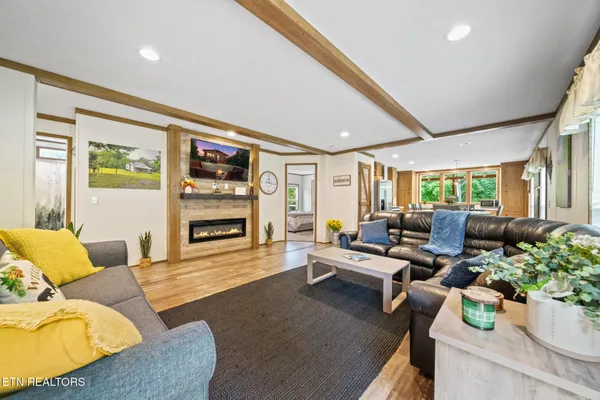 a living room with furniture and a fireplace