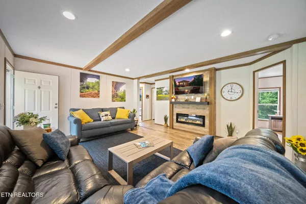 a kitchen with granite countertop a sink a counter top space and stainless steel appliances