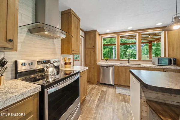 a view of washer and dryer with wooden floor