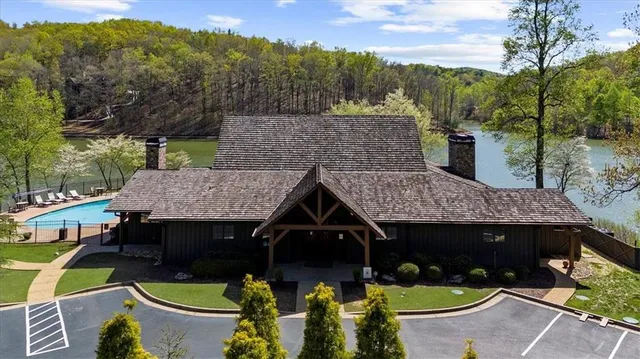 a aerial view of a house with swimming pool and porch