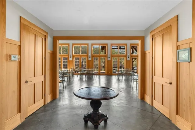 a room with lots of furniture and a large window