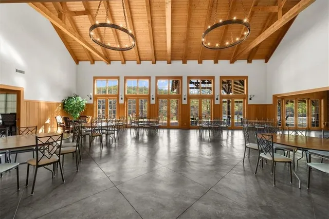 a view of a dining room with furniture and window