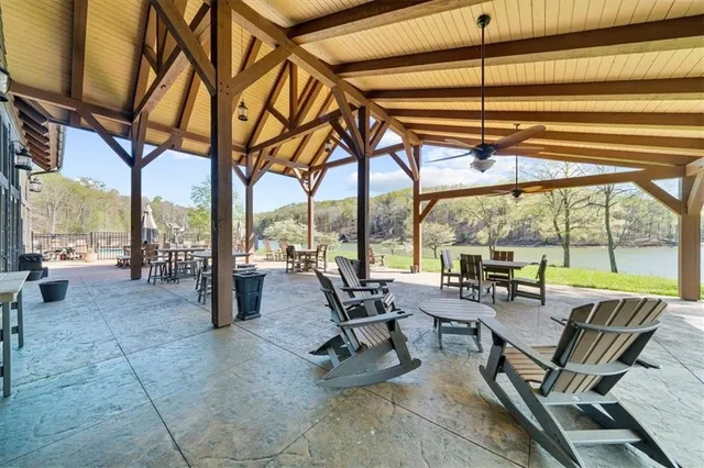 a building outdoor space with patio furniture and wooden floor