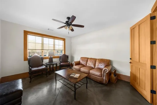 a living room with furniture and a window