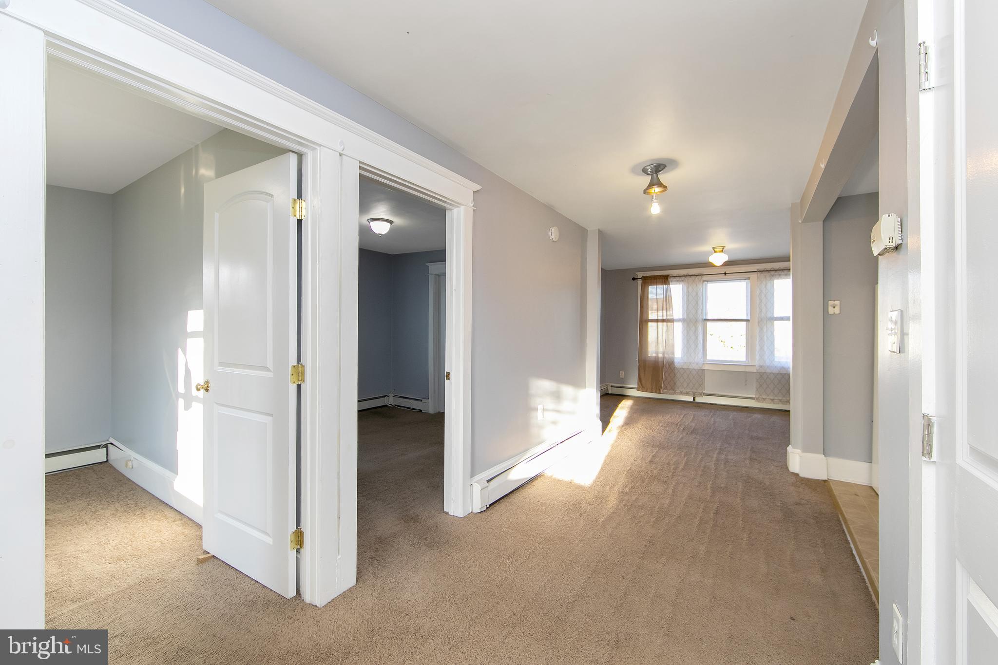 11-13 Church Street, Unit B Glassboro, NJ 08028 - Photo 12 of 33 wooden floor in an empty room and a window