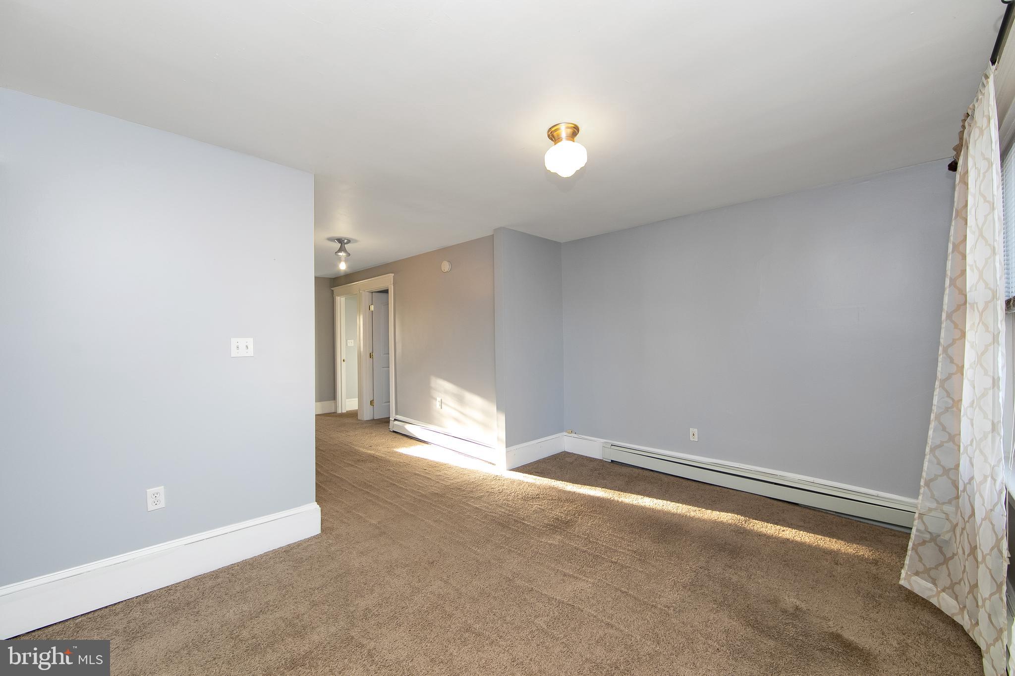 11-13 Church Street, Unit B Glassboro, NJ 08028 - Photo 15 of 33 a view of an empty room with a window
