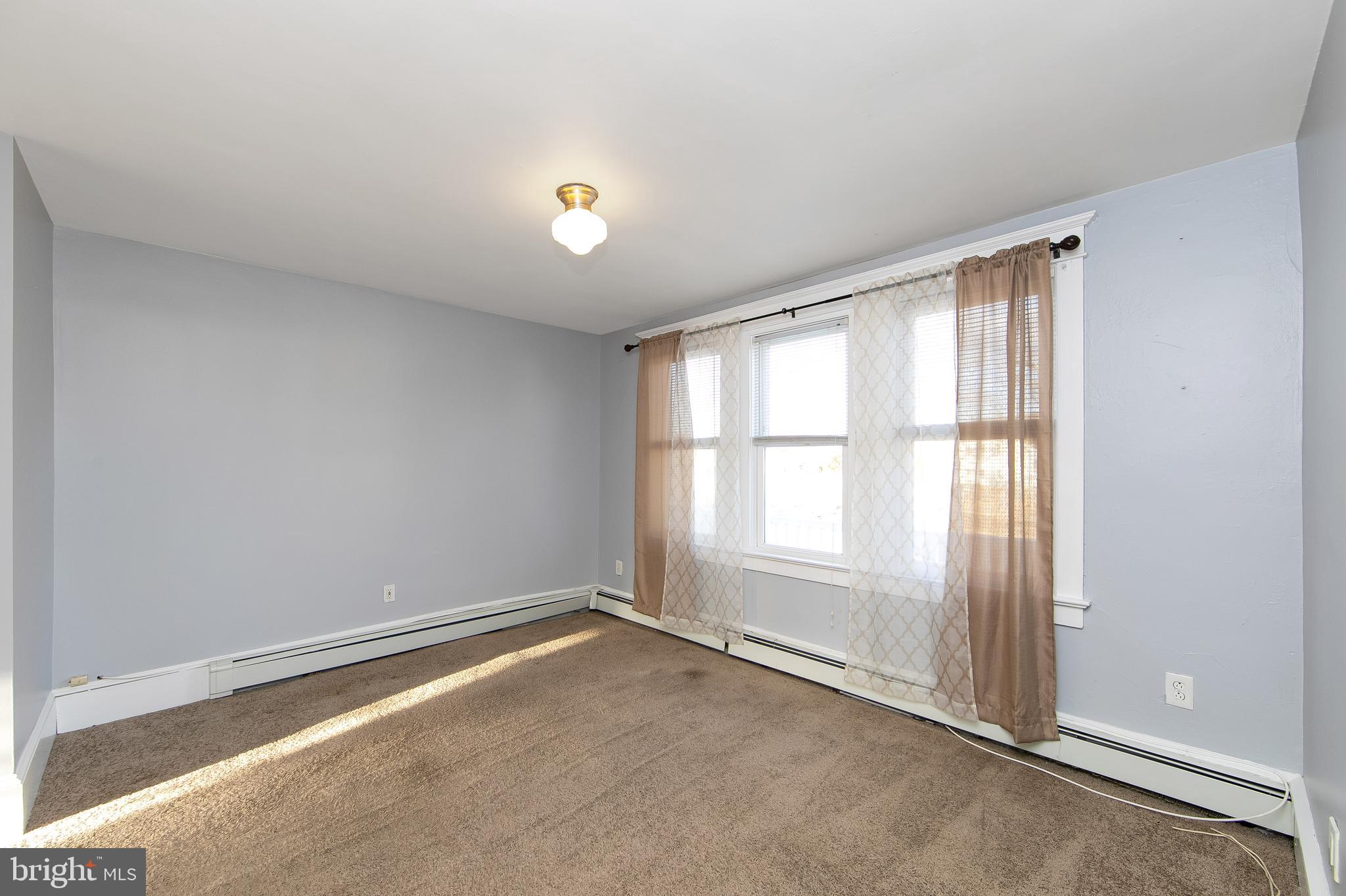 11-13 Church Street, Unit B Glassboro, NJ 08028 - Photo 16 of 33 an empty room with a window