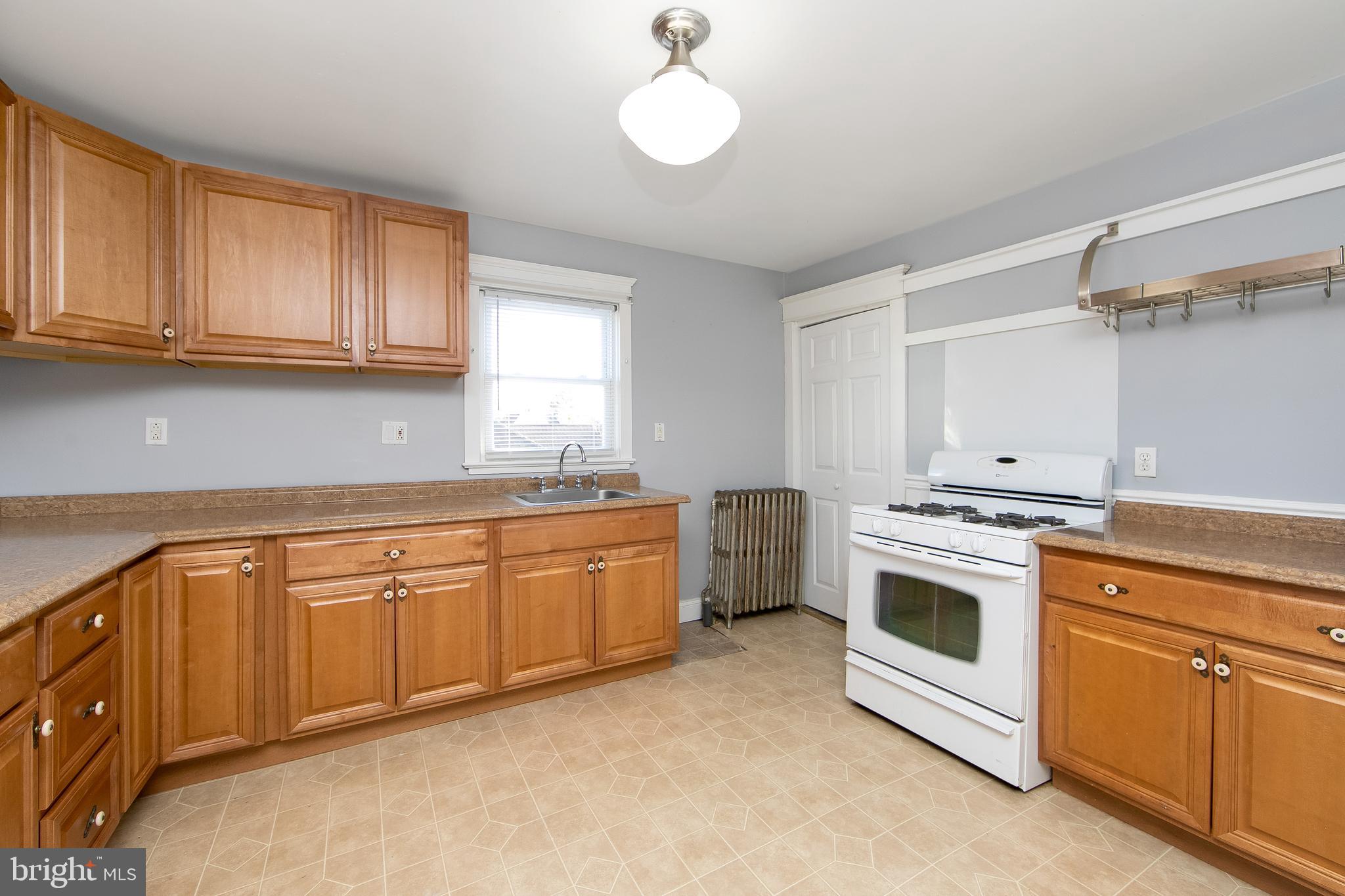 11-13 Church Street, Unit B Glassboro, NJ 08028 - Photo 19 of 33 a kitchen with granite countertop white cabinets and white appliances