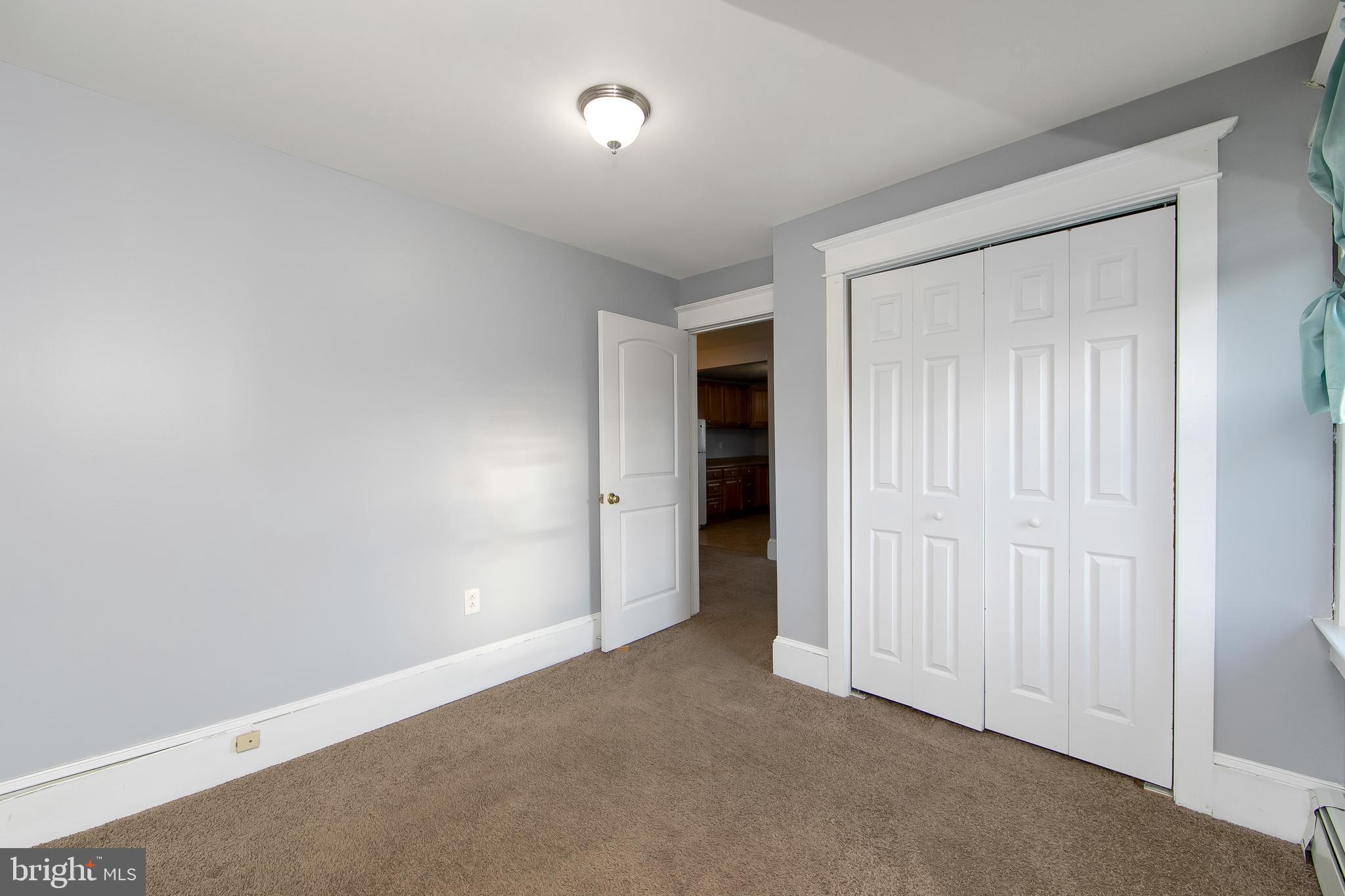 11-13 Church Street, Unit B Glassboro, NJ 08028 - Photo 29 of 33 an empty room with closet area