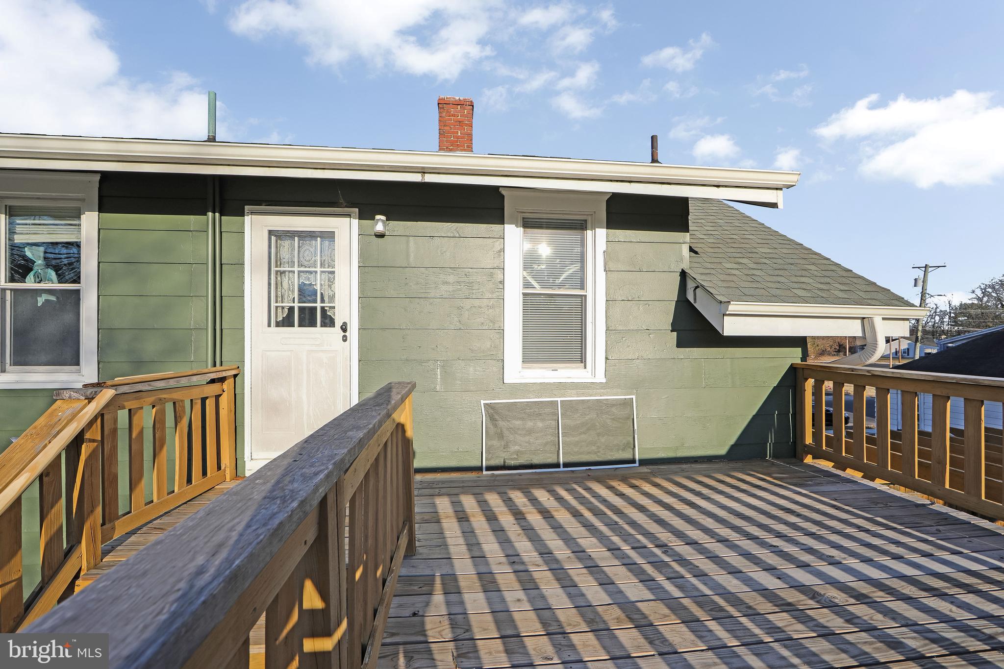 11-13 Church Street, Unit B Glassboro, NJ 08028 - Photo 10 of 33 a view of a roof deck with wooden floor and fence