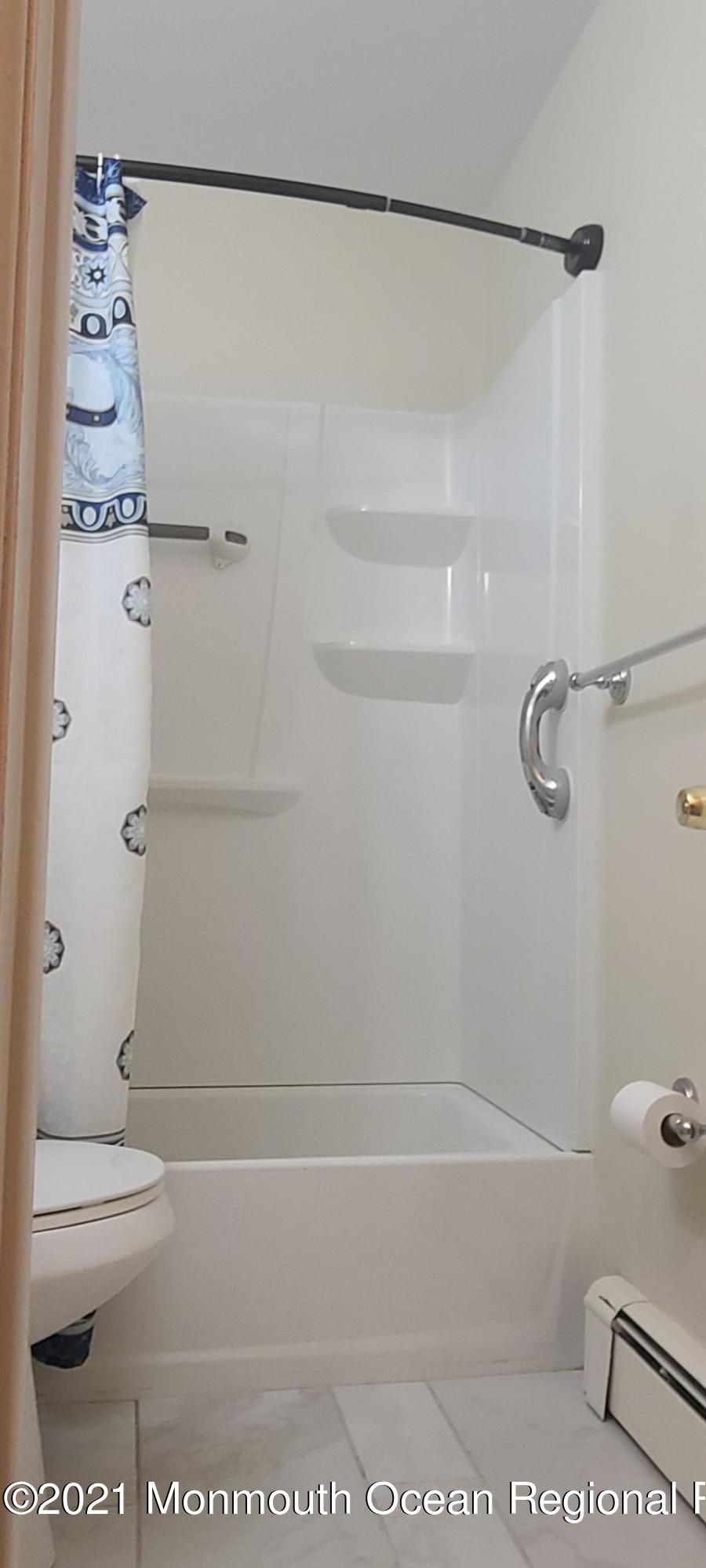 4 A West Road Jackson, NJ 08527 - Photo 14 of 23 a bathroom with a shower a toilet and a shower