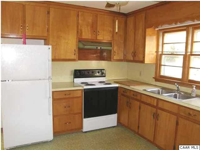 1816 Old Orchard Road Free Union, VA 22940 - Photo 8 of 16 a kitchen with a refrigerator sink and cabinets