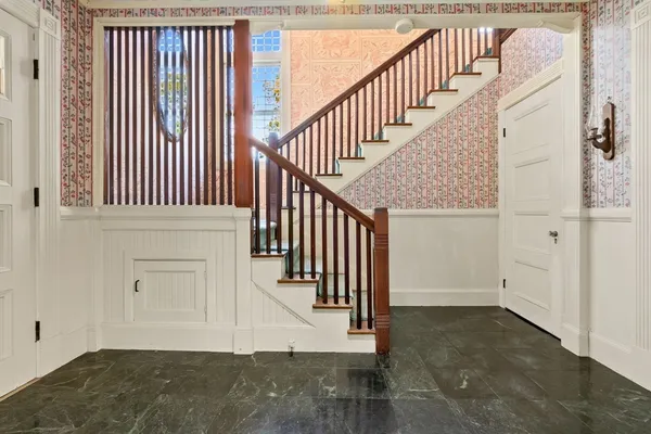 a view of a bathroom with bathtub and windows