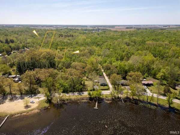 a view of a city with lots of residential buildings and mountain view in back