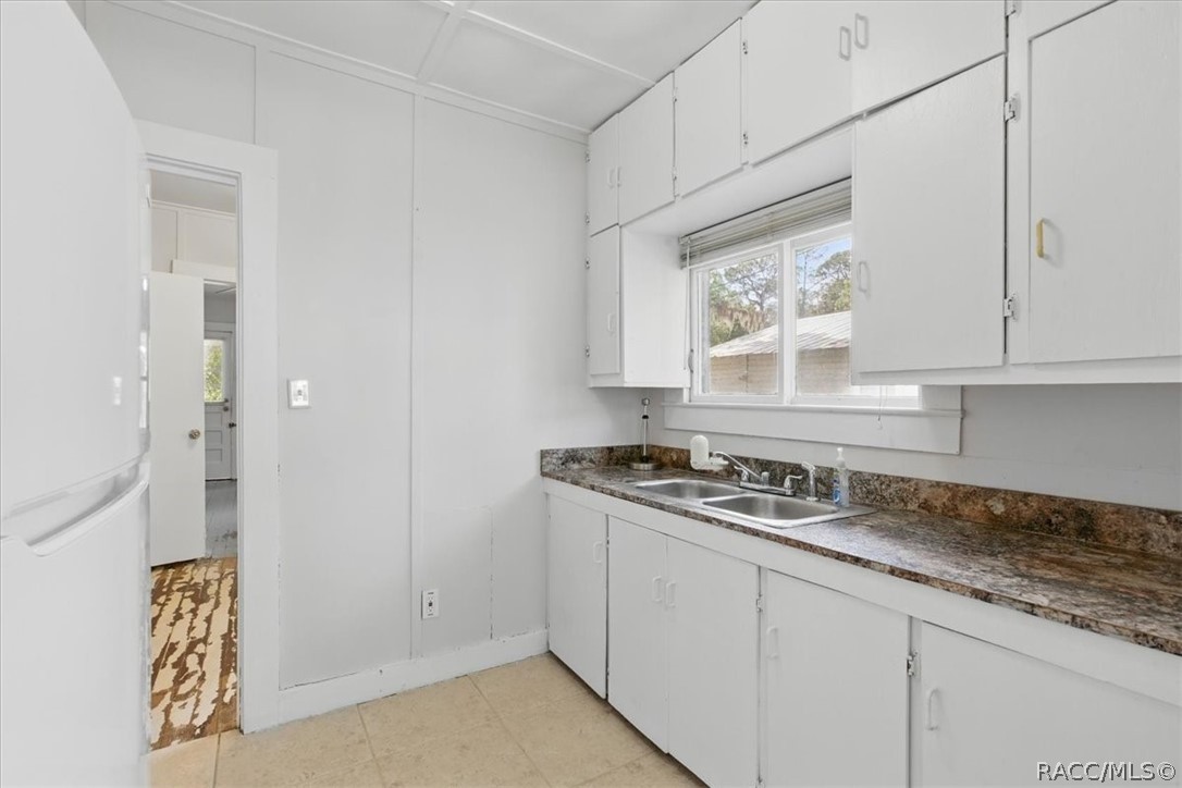 6 62nd Street Yankeetown, FL 34498 - Photo 43 of 55 a kitchen with stainless steel appliances granite countertop a sink and a stove