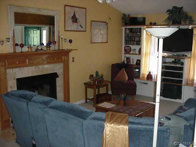 1424 Oldbury Road Midlothian, VA 23113 - Photo 5 of 6 a living room with furniture and a fireplace