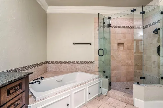 a bathroom with a tub and a shower