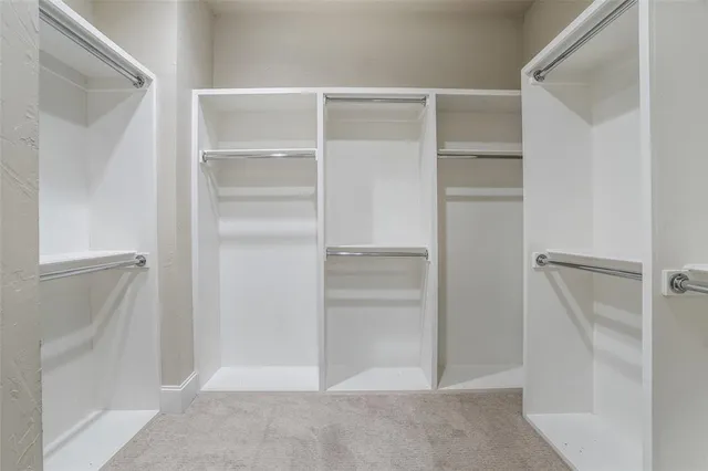 a view of an empty walk in closet