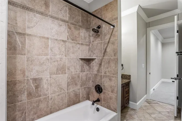 a bathroom with a tub and a shower