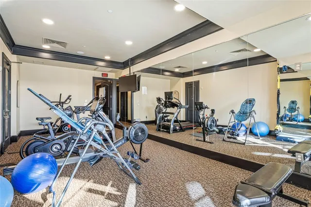 a dining hall with couches a table and chairs with wooden floor
