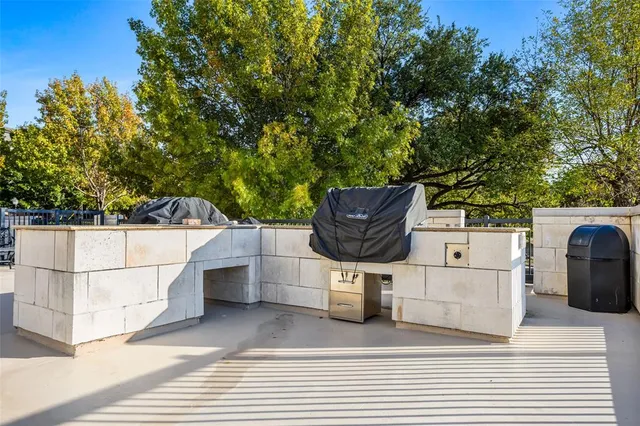 a kitchen with stainless steel appliances granite countertop a refrigerator and a stove