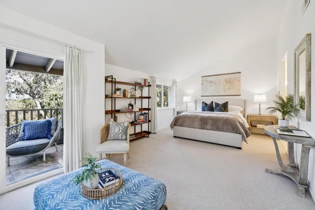 a bedroom with a bed and a couch