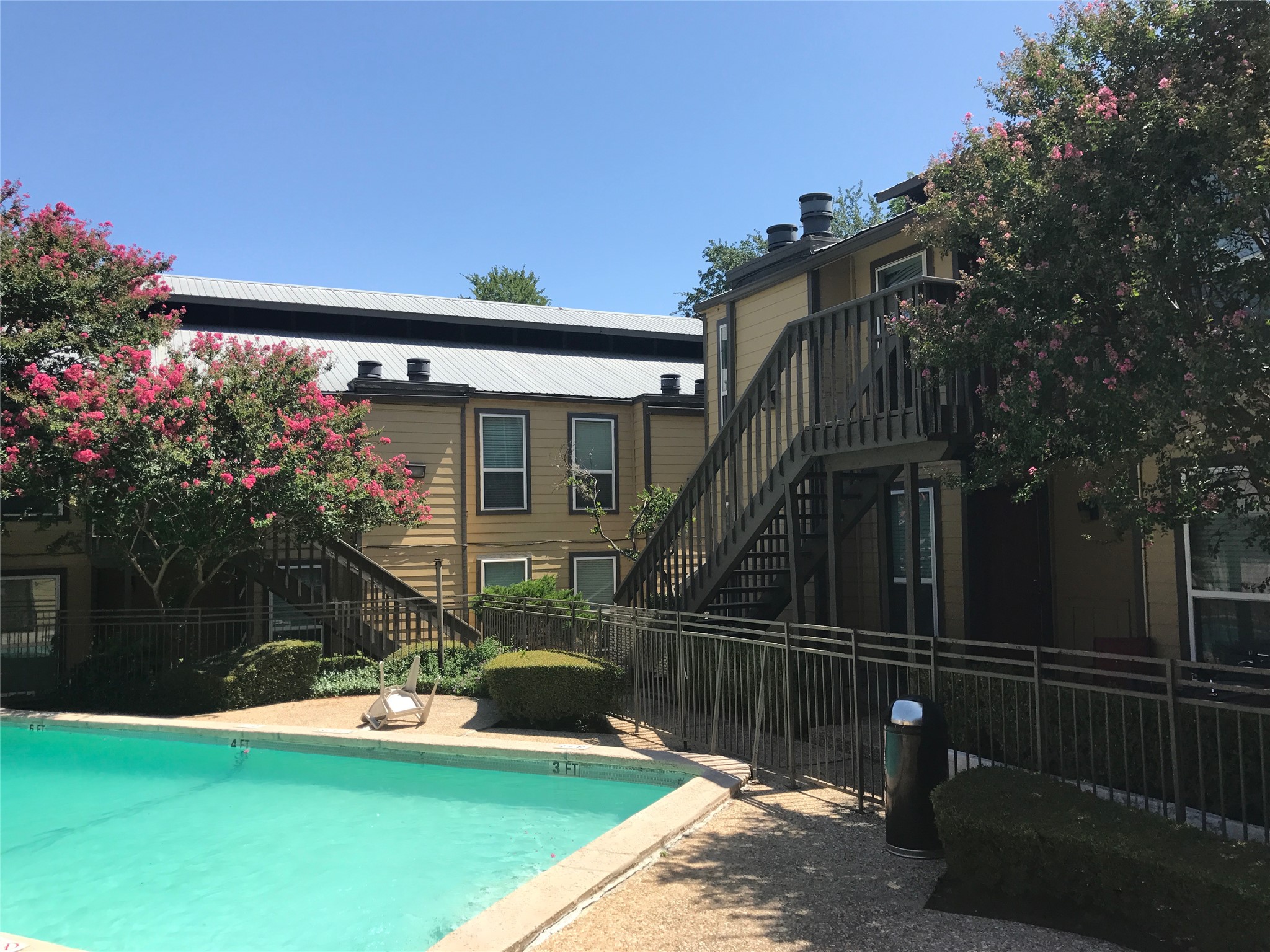 1000 West 26th Street, Unit 112 Austin, TX 78705 - Photo 12 of 14 a view of a house with backyard and porch