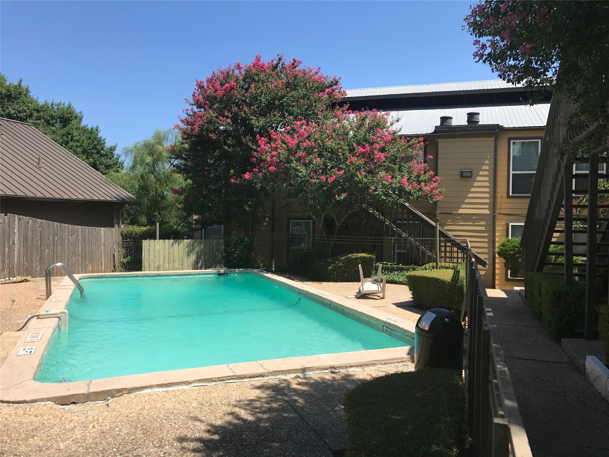1000 West 26th Street, Unit 112 Austin, TX 78705 - Photo 5 of 14 a view of a house with a backyard