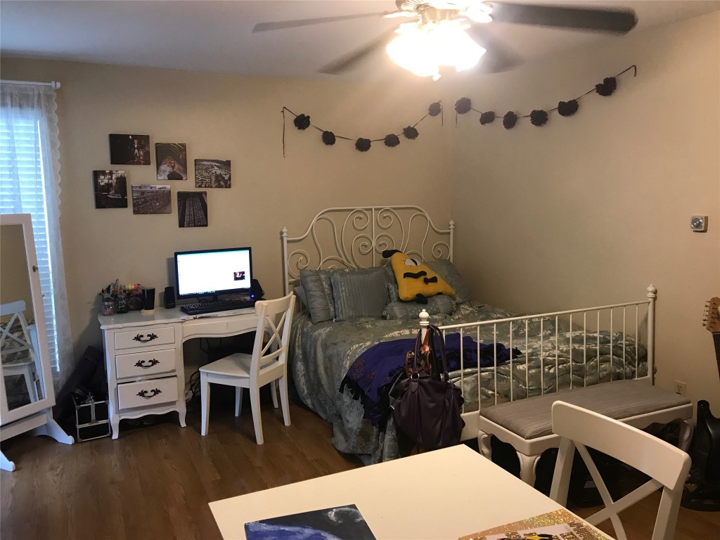 1000 West 26th Street, Unit 112 Austin, TX 78705 - Photo 5 of 15 a bedroom with furniture and a window