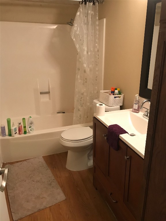 1000 West 26th Street, Unit 112 Austin, TX 78705 - Photo 10 of 15 a white toilet sitting next to a bathroom sink