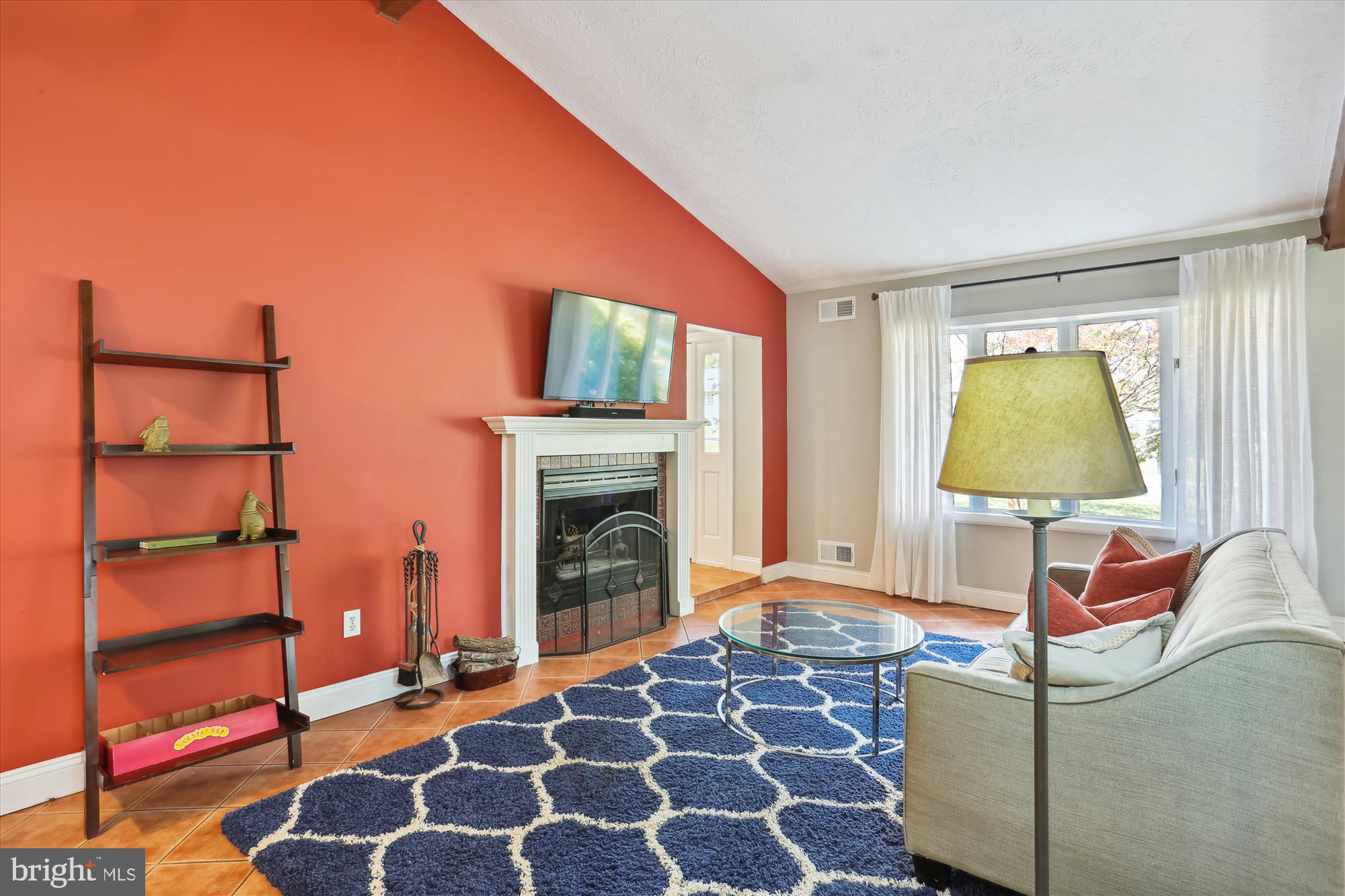 19500 Wootton Avenue Poolesville, MD 20837 - Photo 19 of 62 a living room with furniture and a fireplace