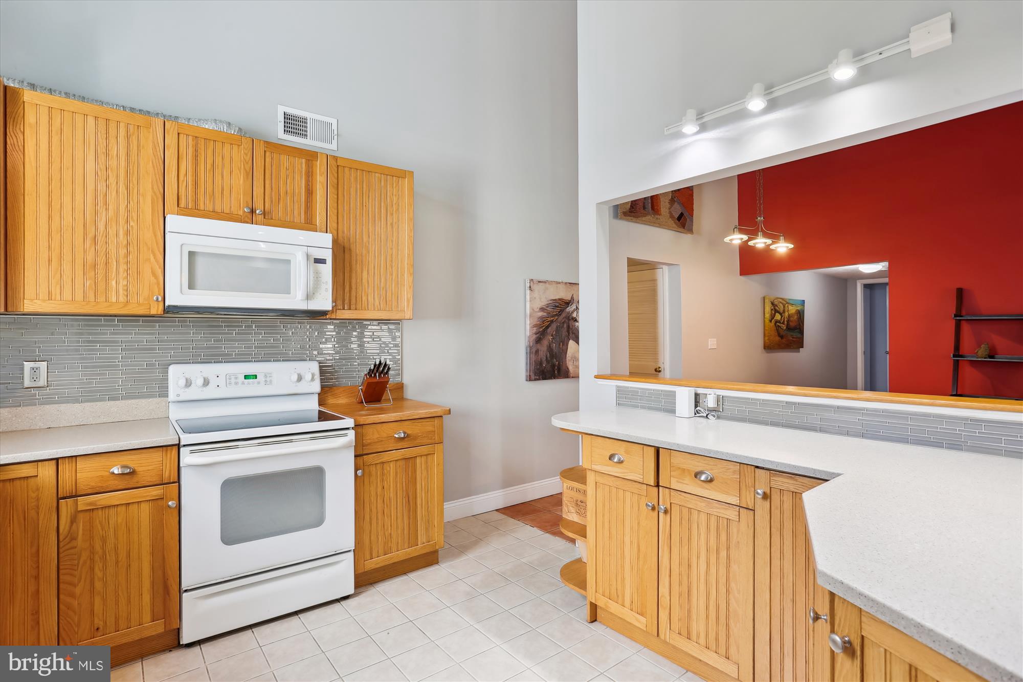 19500 Wootton Avenue Poolesville, MD 20837 - Photo 25 of 62 a kitchen with stainless steel appliances granite countertop a stove a sink and a microwave