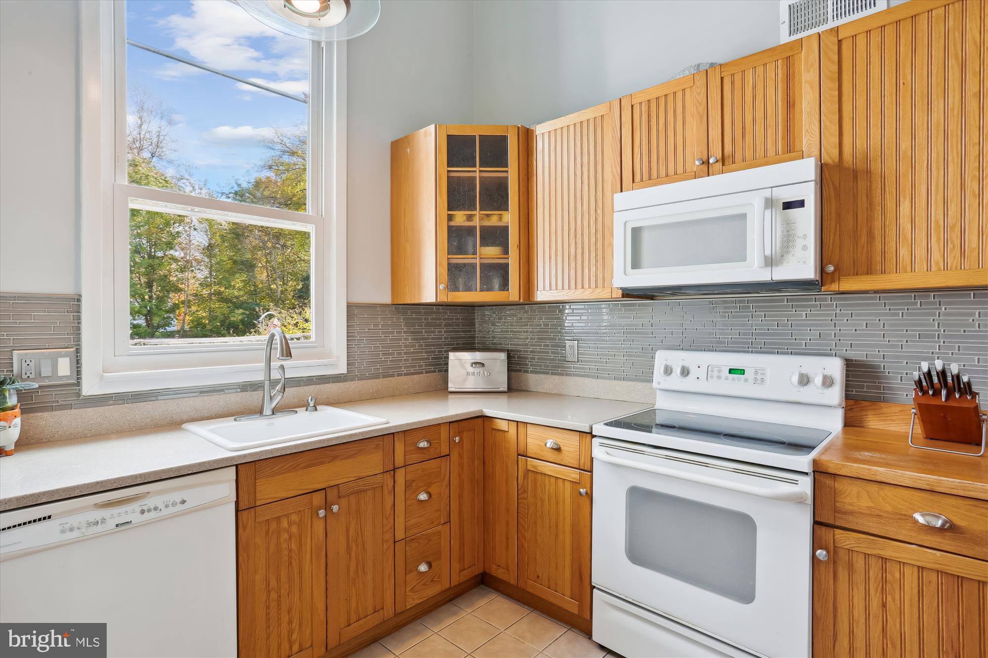 19500 Wootton Avenue Poolesville, MD 20837 - Photo 28 of 62 a kitchen with a sink stove and cabinets