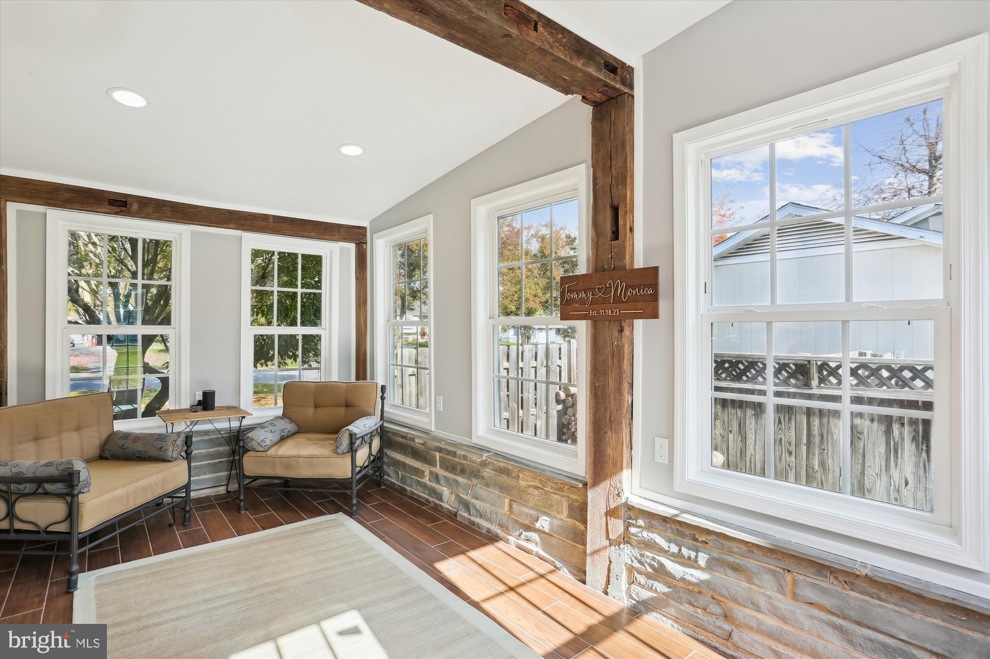19500 Wootton Avenue Poolesville, MD 20837 - Photo 29 of 62 a living room with furniture and floor to ceiling windows