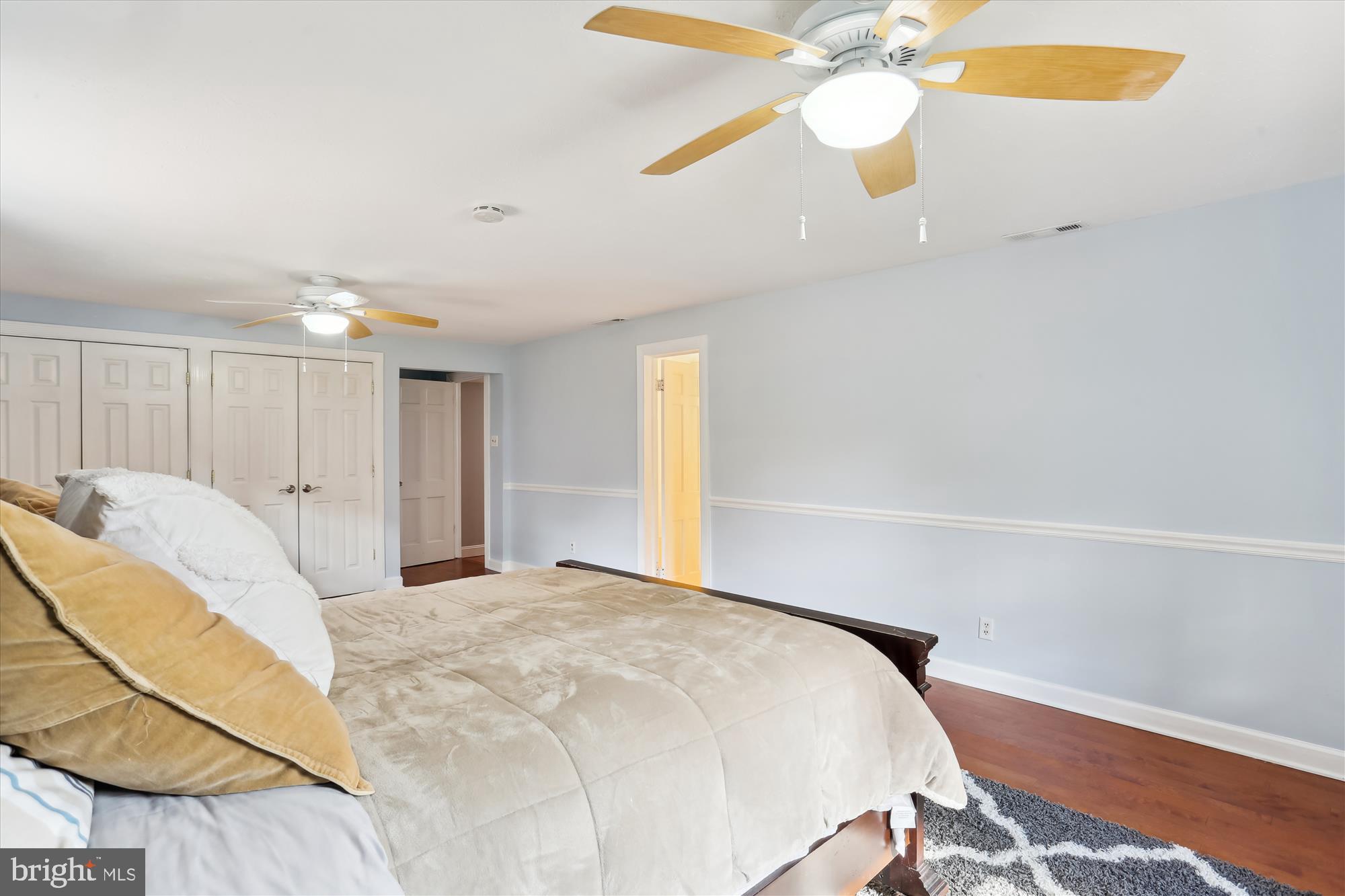 19500 Wootton Avenue Poolesville, MD 20837 - Photo 37 of 62 a bedroom with a bed and a chandelier