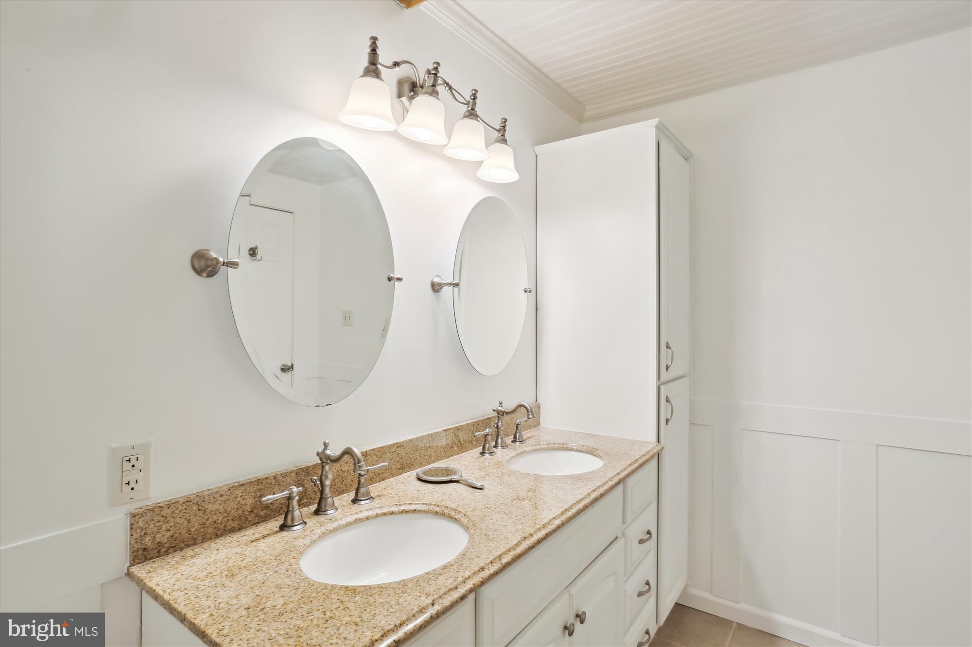 19500 Wootton Avenue Poolesville, MD 20837 - Photo 39 of 62 a bathroom with a granite countertop sink and a mirror