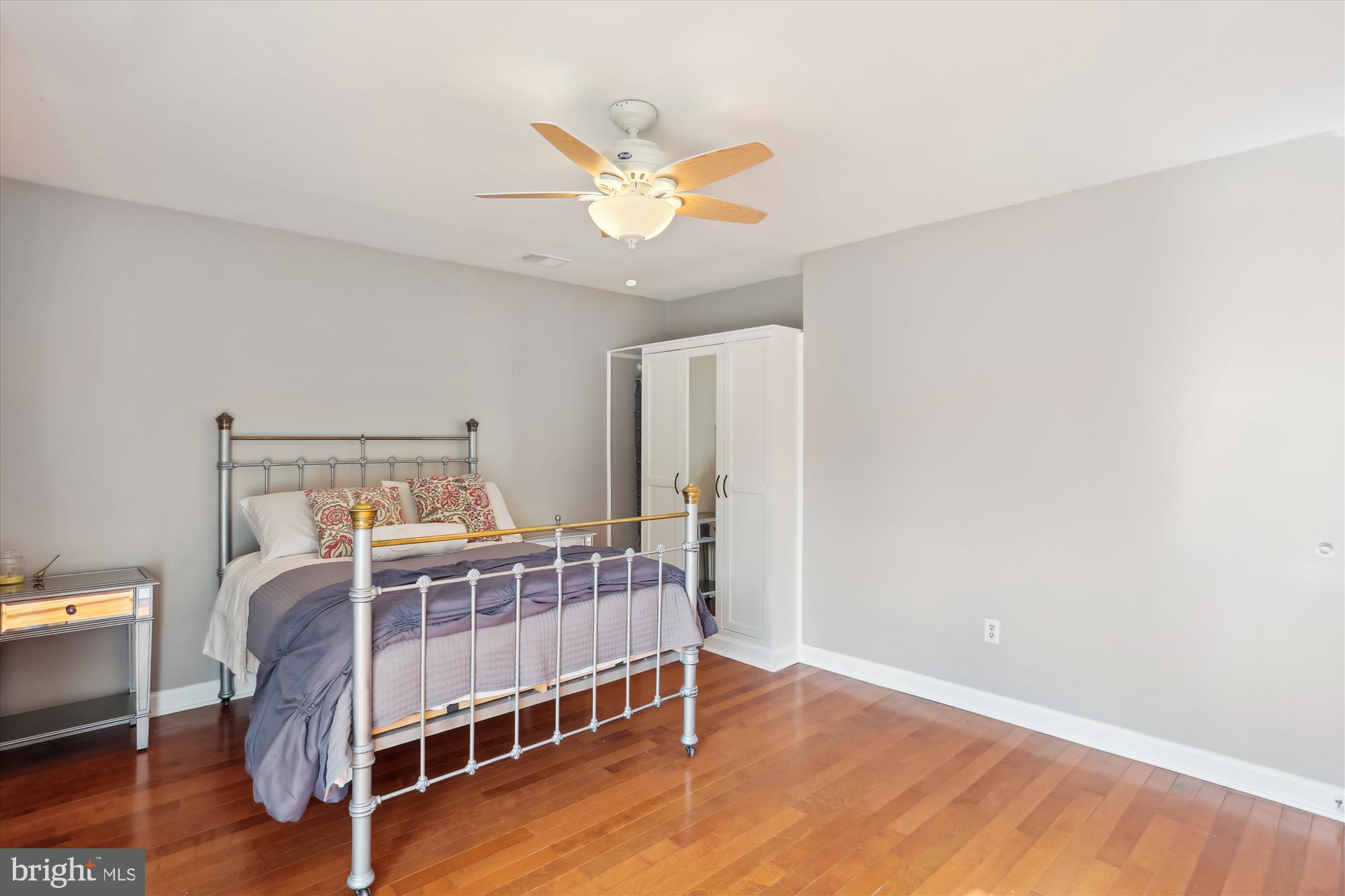 19500 Wootton Avenue Poolesville, MD 20837 - Photo 45 of 62 a bedroom with a bed and wooden floor