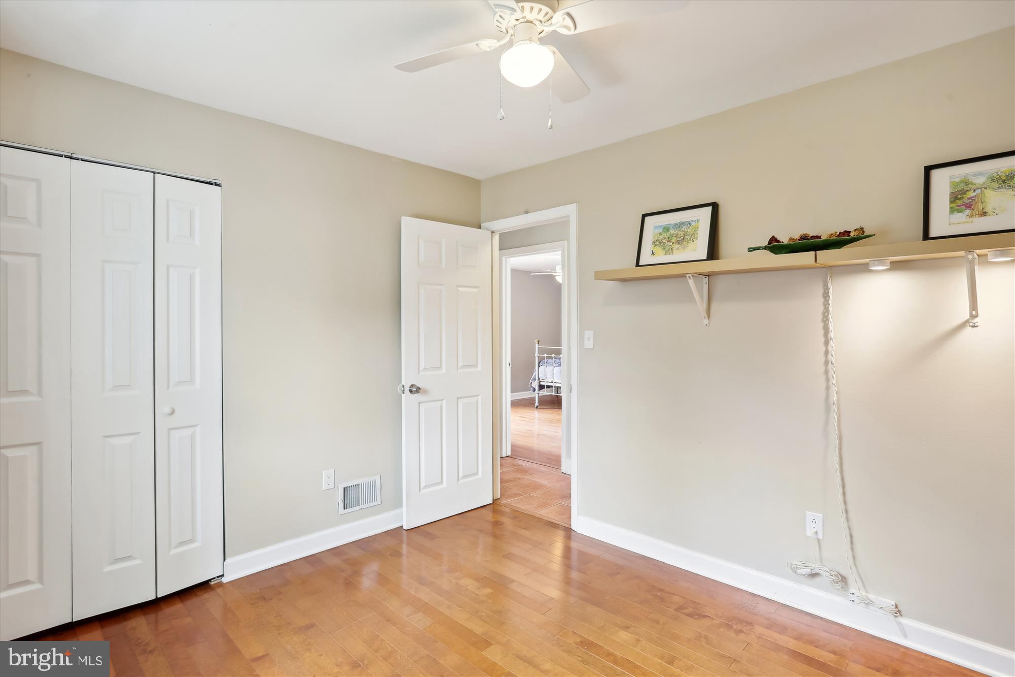 19500 Wootton Avenue Poolesville, MD 20837 - Photo 50 of 62 a view of an empty room with wooden floor