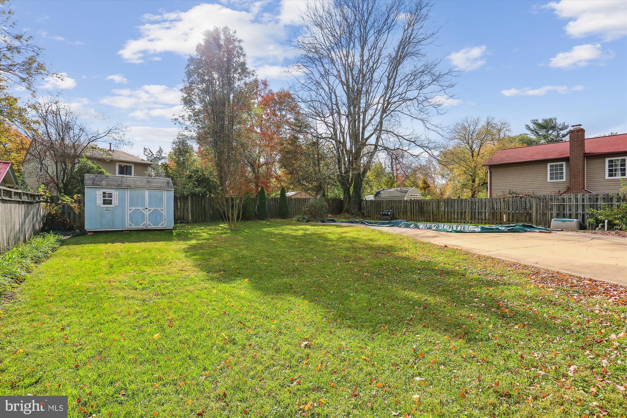 19500 Wootton Avenue Poolesville, MD 20837 - Photo 57 of 62 a view of a yard with a house in the background