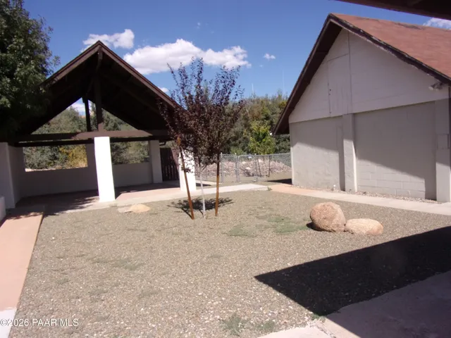 a house with trees in the background
