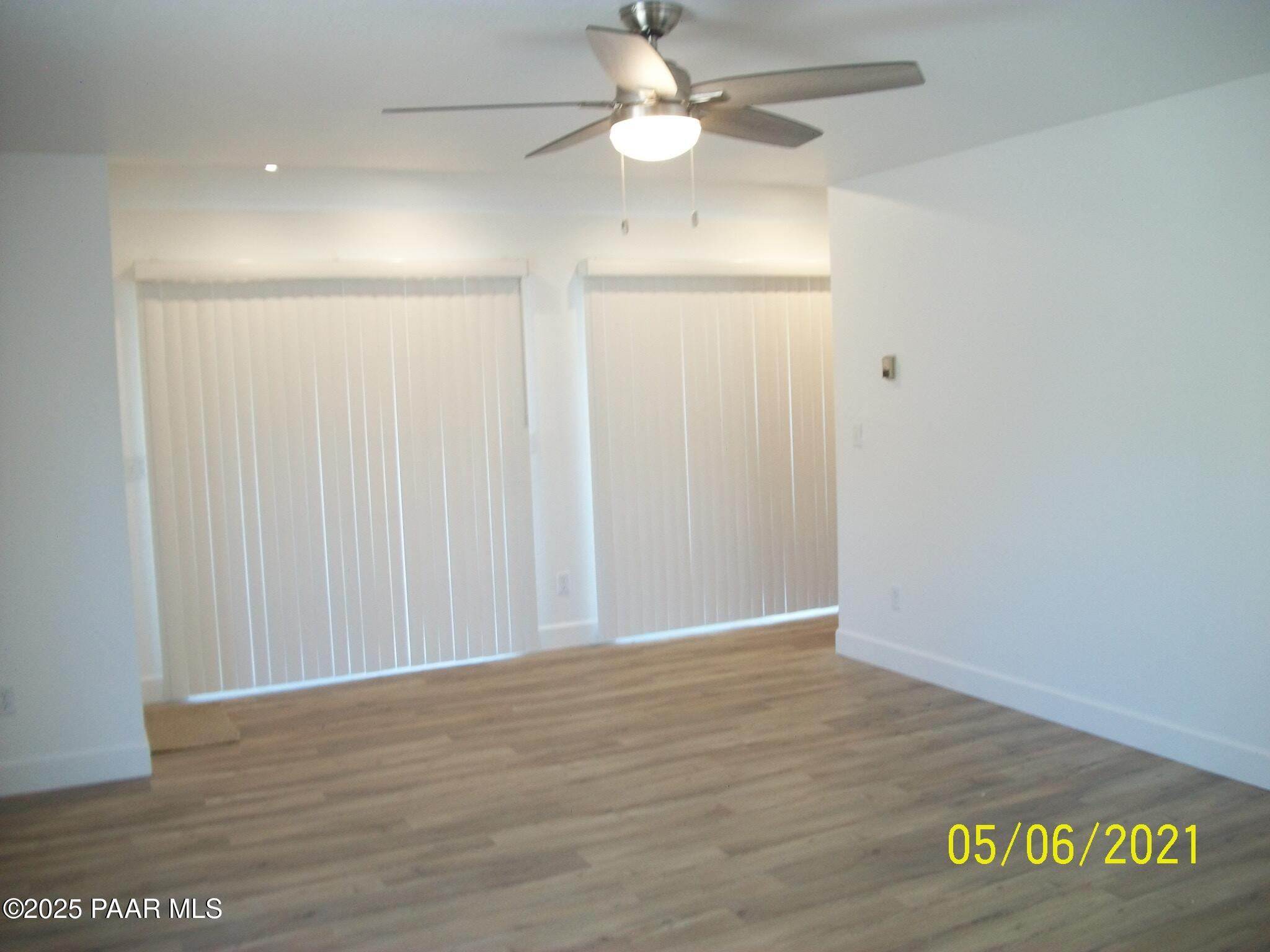 5270 Diamond Drive, Unit B Prescott, AZ 86301 - Photo 2 of 12 a view of an empty room with wooden floor